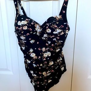 Nip tuck black floral one piece bathing suit.  NWOT.